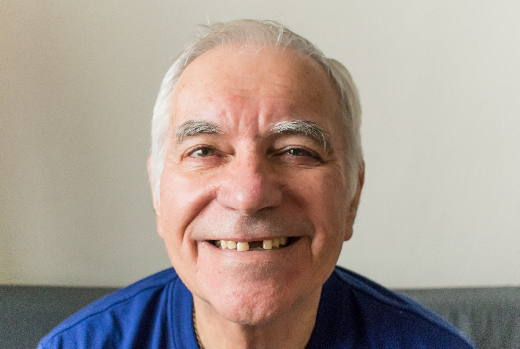 older man smiling showing gap in smile