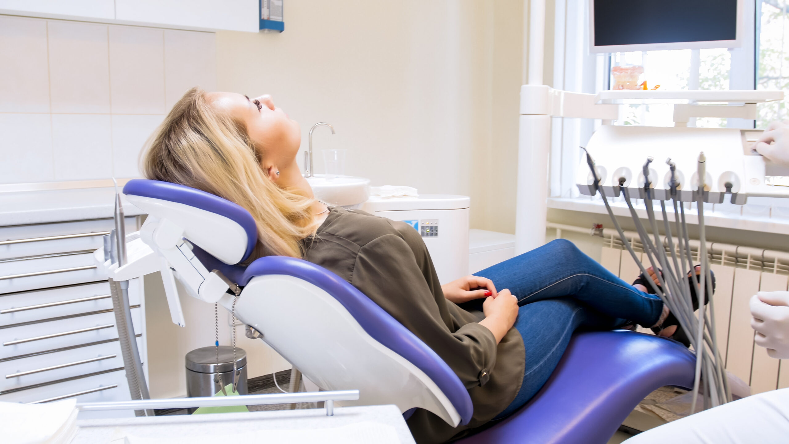 young woman relaxed in a modern dental chair