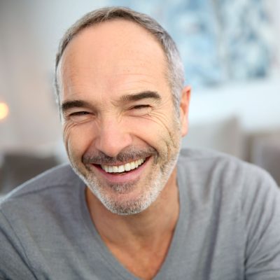 Shutterstock_163960556- edit clinton township man after getting same day crowns in Shelby Township