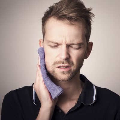 dental-emergency-clinton-township clinton township man with toothache in need of emergency dentistry