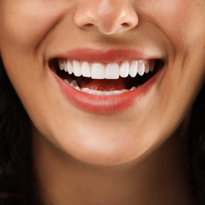 closeup of a woman flashing her flawless smile